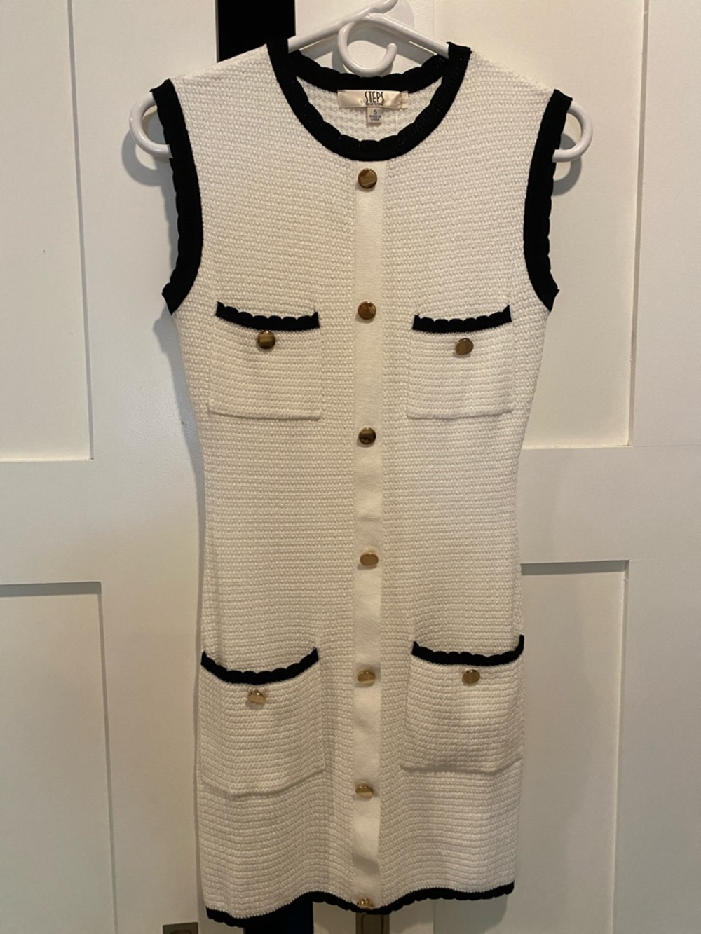 Sleeveless White Mini Dress with Black Trim and Gold Buttons